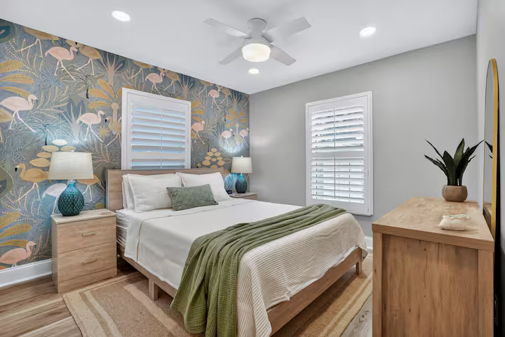 Guest bedroom with flamingo accent wall